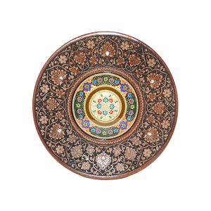 large carved wooden plate with colourful design