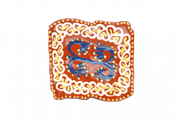 Handcrafted ceramic plate with a unique design.